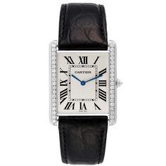 Cartier Tank Louis XL 18k White Gold Diamond Mens Watch WT200006. Manual-winding movement. 18k white gold case 40.4 mm x 34.92 mm with a row of diamonds on the sides. Circular grained crown set with faceted diamond. Original Cartier factory diamond bezel. Mineral glass crystal. Silvered grained dial. Painted black roman numerals. Sword shaped blued steel hands. Secret Cartier signature at VII. Black alligator strap with the 18k white gold deployant buckle. Cartier Black Watch With Rectangular Dial, Cartier Black Business Watch, Cartier Black Business Watch Accessories, Designer Formal Watches With Date Indicator, Cartier Rectangular Chronometer Watch, Cartier Chronograph Watches With Rectangular Dial, Timeless Rectangular Cartier Watch, Cartier Rectangular Business Watch, Elegant Cartier Chronograph Watch