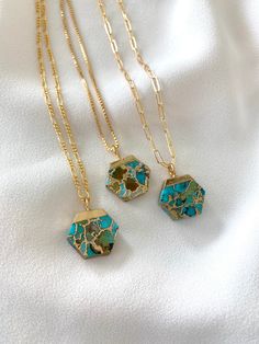 *Each piece in my shop, I personally create and photograph. (All photos are property of The Cord Gallery LLC) Thank you for supporting my small business.Raw Mojave Turquoise Hexagon Pendant Necklace Add a new twist to the classic Turquoise Necklace with these stunners! Features raw, Mojave Turquoise, that is cut into Hexagon shapes and topped in gold electroplating. Each stone has a unique amount of turquoise, darker green, browns and bright turquoise tones. Stones are double sided and 100% uniq Green Octagon Necklaces As Gift, Green Octagon Necklace For Gift, Blue Hexagon Jewelry For Gifts, Hexagonal Gemstone Necklace For Gifts, Hexagon Gemstone Necklace As A Gift, Hexagon Gemstone Necklace For Gift, Hexagonal Gemstone Necklace As Gift, Hexagon Faceted Necklace For Gifts, Hexagonal Gemstone Necklace Gift