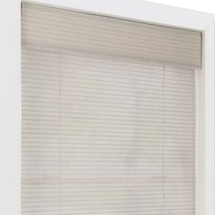 an open window with white blinds on it