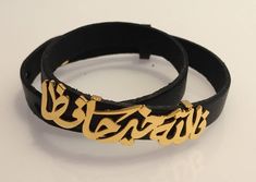 "Handmade leather bracelet with your name or statement of your own. Calligraphy Arabic name bracelet. Best gift for him or her You can choose any statement from the listing photos or send me your name or statement (4 words max) Leather is genuine and re-sizable with several resizing holes. Please scroll the listing photos to see more options. All photos listed are with Islamic Ayah and you can customize your own statement. Please follow these steps to make your order: 1- Choose finish and leathe Personalized Black Leather Bracelet As Gift, Personalized Black Leather Bracelet Gift, Gold Leather Bracelet As Gift, Elegant Personalized Black Name Bracelet, Elegant Black Personalized Name Bracelet, Leather Bangle Bracelets As Gifts, Personalized Elegant Leather Bracelet As Gift, Elegant Personalized Leather Bracelet For Gift, Personalized Elegant Leather Bracelet Gift