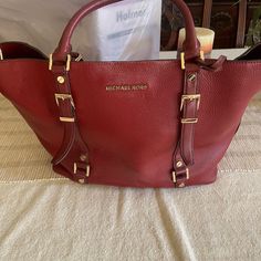 Red Mk Purse. Classic Bag . Matching Wallet For Additional $50. Excellent Condition No Wear No Stains. New Condition Designer Burgundy Shoulder Bag With Branded Hardware, Red Luxury Satchel With Leather Handles, Luxury Red Satchel With Leather Handles, Designer Red Satchel For Travel, Designer Red Bags With Gold-tone Hardware, Red Leather Designer Satchel, Designer Red Leather Satchel, Designer Red Satchel With Gold-tone Hardware, Red Travel Bags With Gold-tone Hardware