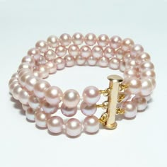 Three strands of gorgeous nude (natural pink) pearls in a classic cuff bracelet. Custom made to fit properly or choose an adjustable clasp if you are not exactly sure of the wrist size. Pearl type: Freshwater Cultured Pearls Pearl shape: Semi-Round Pearl Color: Natural Pink Pearl Size: 6-6.5 mm Clasp: Tube Clasp, 14k Gold Filled or Sterling Silver String: Safe-Knotted Every Inch Length: 6.5, 7, 7.5, or 8" Bracelet made in Chicago, IL by Bourdage Pearls. 1800s Jewelry, Pearl Pink Color, Pink Pearl Jewelry, Pink Pearl Bracelet, Cultured Pearl Bracelet, Fancy Jewelry Necklace, Pearl Necklace Designs, Pink Pearls, Pearl Bangle