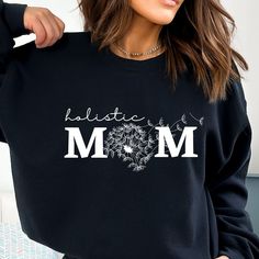 Holistic Mom sweatshirt, These warm, super soft sweatshirts are incredibly comfy! . The collar is ribbed knit, so it retains its shape even after washing. There are no itchy side seams on these sweaters.  .: 50% cotton, 50% polyester .: Medium-heavy fabric .: Loose fit .: Sewn-in label .: Runs true to size Casual Black Sweatshirt For Mother's Day, Casual Crew Neck Sweatshirt For Mother's Day, Mother's Day Casual Long Sleeve Sweatshirt, Casual Long Sleeve Sweatshirt For Mother's Day, Holistic Mom, Natural Mama, Crunchy Mom, Crunchy Mama, Crunchy Moms