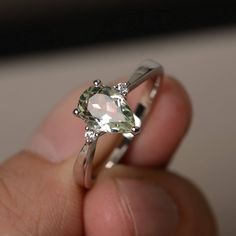 This is a gorgeous handmade creation. Its beauty is its simplicity & Elegance. The 6*9 mm pear shape faceted natural green amethyst is crafted in solid sterling silver and with rhodium plated. All item is sent in a beautiful gift box If you have any idea of design your ring,pls contact me directly. You can realize more lovely stuff clicking the link https://www.etsy.com/shop/knightjewelry?refshopsection_shophome_leftnav Please leave the correct address and you phone number for delivering suc Green Amethyst Rings For Wedding, Silver Teardrop Jewelry For Proposal, Teardrop Amethyst Ring For Anniversary, Pear Shaped Gemstone Rings For Proposal, Pear-shaped Gemstone Ring For Proposal, Teardrop Gemstone Ring For Proposal, Green Teardrop-shaped Promise Ring, Teardrop Amethyst Ring For Gift, Silver Teardrop Emerald Ring For Anniversary