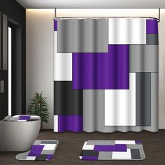 a modern bathroom with purple and grey decor on the shower curtain, rugs and bathtub