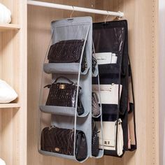 an organized closet with hanging purses and handbags