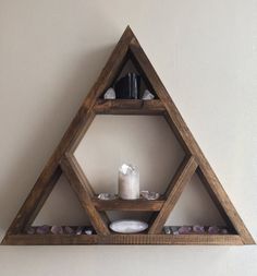 a wooden shelf that has some rocks in it