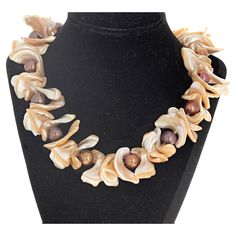 These magnificent Pearl shells surround the glowing bright real cultured round different colored Pearls. The largest of the shells are approximately 30mm long. The Pearls are approximately 12mm round. This 19 inch long necklace has a beautiful easy to use gold plated slide-in clasp. This is absolutely magnificent on a brown or black blouse or sweater where the Pearls glitter goldy. Luxury Unique Mother Of Pearl Shell Necklace, Real Pearl Jewelry, Colored Pearls, Diy Jewelry Display, Chunky Jewelry, Real Pearls, Natural Pearl, Shell Jewelry, Pearl Shell