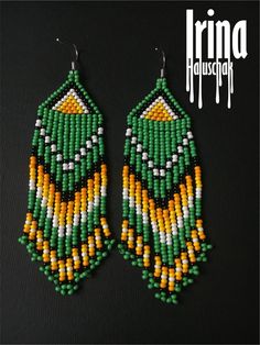 Green and yellow beaded earrings Long tassel seed bead earrings Dangle indian earrings Boho jewelry Fringe Chandelier earrings Tribal Very lightweight. Fusion between ethnic style and modern elements. Original design. Measurements: Length with hook - 3.9 inches (10 cm) Width - 1 inch (2.6 сm) Materials: Silver plated ear hooks Czech glass beads Nylon Thread Patience and Creativity 100% handmade. Shipping worldwide .. ready to be given away ! Thanks for view! I accept Paypal. Add to cart to confi Traditional Green Teardrop Beaded Earrings, Traditional Beaded Tassel Dangle Earrings, Traditional Beaded Fringe Chandelier Earrings, Traditional Beaded Dangle Earrings With Tassels, Yellow Beaded Bohemian Chandelier Earrings, Traditional Beaded Fringe Dangle Earrings, Traditional Green Beaded Dangle Earrings, Bohemian Yellow Beaded Chandelier Earrings, Festival Beaded Dangle Chandelier Earrings