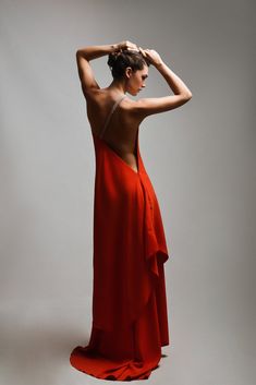 A mesmerizing red dress that embodies both allure and sophistication, showcasing a daring open-back design that adds a touch of sensuality. The focal point of this stunning ensemble is a meticulously crafted belt, adorned with hand-sewn stones, accentuating the shoulder and the back with a dazzling display of shimmer. The rich red hue of the dress exudes confidence and passion, while the intricately embellished belt elevates the glamour quotient. Together, the open back and the bedazzled belt cr Elegant Evening Dress With Low Back For Night Out, Elegant Low Back Evening Dress For Night Out, Gala Backless Dress, Backless Evening Dress For Gala, Elegant Low Back Maxi Dress For Party, Glamorous Evening Dress With Low Back, Evening Dresses With Low Back And Back Opening, Elegant Low Back Backless Dress For Evening, Low Back Evening Dresses With Back Opening