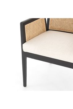 a black and white chair with wicker backrests on an isolated white background