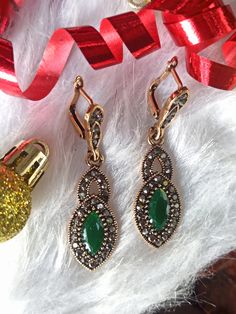 Authentic Turkish Style Unique Earrings Vintage Ottoman Style HURREM SULTAN   Hurrem Sultan Magnificent Century A beautiful and stylish accessory! Authentic and unique Turkish design. Ottoman-style vintage jewelry that will make you feel like real Sultana from Ottoman Dynasty. Named after The Great Hurrem Sultan, the earrings are antique gold in color with crystals and green resin stone. Elegant Christmas Jewelry With Matching Earrings, Elegant Christmas Drop Earrings, Elegant Christmas Jewelry With Dangle Shape, Elegant Christmas Jewelry For Formal Occasions, Elegant Christmas Formal Jewelry, Elegant Green Earrings For Christmas, Magnificent Century Jewelry, Elegant Silver Earrings For Christmas, Elegant Silver Christmas Earrings