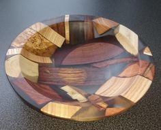 a wooden bowl sitting on top of a table