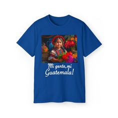 a blue t - shirt with an image of a woman holding flowers in her hands