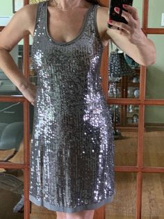 Beautiful Calvin Klein Exclusive silver sequined slip dress, size Small. Was bought in Calvin Klein boutique for over $200. The dress is fully lined, 100% silk, high quality sequins not cheap loosing color plastic. In great vintage condition. For measurements look at the pictures. Thank you for watching and feel free to ask if you have any questions. Sleeveless Evening Dress With Shine, Elegant Silver Sequin Fabric For Night Out, Metallic Sequin Fabric For Evening And Holiday, Elegant Sequin Dress For Evening, Metallic Elegant Sequin Fabric For Night Out, Elegant Metallic Sequin Fabric For Night Out, Metallic Fitted Sequin Dress For Holiday Party, Metallic Sequin Dress For Holiday Party, Elegant Party Sequin Dress With Shine