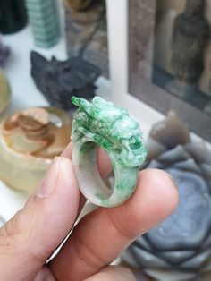 Vintage, collector's piece, auspicious Chinese Dragon carved Jade ring. Glossy, semitranslucent, green-speckled, Type A natural Jadeite (non-bleached, non-dyed, non-treated material). Ring size US 9.5 (61), weighs 12.12 grams, width 1 cm, height of Dragon from shank 1 cm. Green Intaglio Ring Jewelry, Unique Jade Gemstone Ring, Green Crystal Gemstone Ring For Spiritual Wear, Carved Green Jade Rings, Carved Jade Rings For A Gift, Carved Jade Rings As A Gift, Green Crystal Healing Ring, Green Carved Jade Rings, Spiritual Green Emerald Ring For Wedding