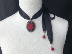 Red rose cameo choker necklace, pendant. Cameo is three dimensional in Victorian Gothic red roses on black background. It is set on antique vintage style cameo tray. Double sided black satin 2.5cm or 1 inch wide. Glass pearl end finishing. Cameo height is 40mm without the metal setting. Cameo width is 30mm without the metal setting. Cameo is made of resin. Cameo tray is alloy. I can customise the necklace any way you want. Different beads, can be facetted crystals, other colours, different lengt Gladiator Sandals For Men, Cameo Choker Necklace, Red And Black Outfits, Red Gothic, Gothic Rose, Goth Wedding, Necklace Red