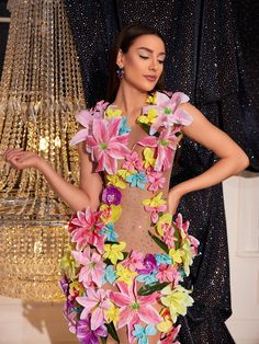 a woman in a dress made out of flowers