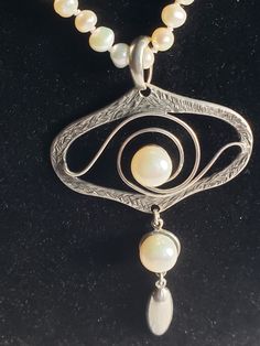 "This designer necklace is so pretty! That Art Nouveau style with lots of swirling sterling  silver. It is large at 3.25\" long with a large bale. The designer name is Kant. Very different and unusual. In perfect, vintage condition on a 22\" curtesy glitter chain or an adjustable mini pearl chain with 3mm pearls from 22\"-24\", your choice! I can send you this beautiful necklace in a gift box tomorrow!" Silver Art Nouveau Necklace For Anniversary, Elegant Necklace With Artistic Round Pendant, Artistic Hand Forged Sterling Silver Necklace, Silver Teardrop Necklaces With Unique Variations, Sterling Silver Teardrop Jewelry With Artistic Design, Artistic Silver Necklace For Anniversary, Silver Spiral Necklace For Anniversary, Handmade Vintage Spiral Jewelry, Artisan Nickel-free Necklace For Anniversary