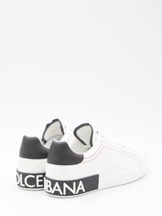 Portofino sneakers in white and black calfskin with red topstitching and white rubber sole. They feature lace-up closure and embossed Dolce & Gabbana logo at the back. ITA size. Size nationality: IT Product number: 3315574 Product code: CS2216AH52689697 Composition: 100% calfskin Designer Low-top Sneakers With Leather Sole, Luxury Calf Leather Sneakers For Streetwear, Designer Sneakers With Contrast Sole, Luxury White High-top Sneakers With Embossed Logo, Classic White Custom Sneakers With Logo, Classic White Custom Sneakers With Logo Detail, White Custom Leather Sneakers With Embossed Logo, Custom Leather Lace-up Sneakers With Logo, Designer Leather Sole Lace-up Sneakers