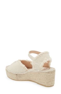 A woven platform and wedge heel underscore the espadrille-inspired style of this summery sandal finished with frayed trim. 2 1/2" heel, 1 1/2" platform (size 39w) Textile upper/synthetic lining and sole Made in Spain Summer Platform Espadrilles In Natural Color, Natural Platform Espadrilles For Summer, Summer Natural Platform Espadrilles, Summer Natural Color Platform Espadrilles, Cream Espadrille Sandals For Vacation, Cream Wedge Heel Espadrilles For Summer, Cream Wedge Heel Espadrilles In Straw, Cream Espadrille Wedge Sandals With Woven Sole, Cream Wedge Espadrille Sandals With Woven Sole