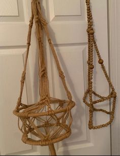 two macrame hanging from the side of a door