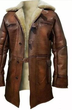 Mterial: 100% Real Leather. * Inner: Artificial fur * Color: Distressed Brown * Collar: Erect collar with Shearling * Pockets: Pockets on upper chest, two flap pockets at waist, and two inside pockets After the remarkable success of the blockbuster Hollywood movie, The Dark Knight Rises, where the noteworthy character of Bane was outstandingly performed by Tom Hardy as a villain and wearing such astonishing Bane leather coat on his physique, is now a part of The Leather City at an amazing price. Bane Jacket, Trench Outfit, Shearling Leather Jacket, Brown Leather Coat, Dark Knight Rises, Leather Coat Jacket, The Dark Knight Rises, The Dark Knight, Custom Jacket