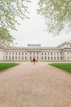 a person standing in front of a large building