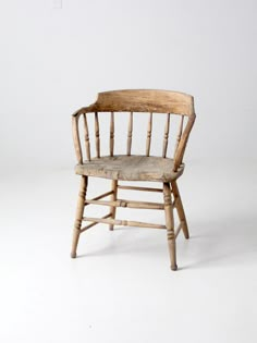 an old wooden chair on a white background