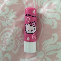 hello kitty lip balm on pink and white background