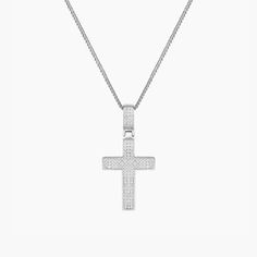 Product Details Chain Type: Mini Cuban Chain Chain Length: 16" + 2" Inch Extension Closure: Lobster Clasp Stone: Cubic Zirconia Metal Selection: Sterling Silver 14k Gold over Silver Description Celebrate your faith with the Zirconia Enriched Cross Pendant Necklace in a high-polish finish. Features a moving cross charm decked with mini cubic zirconia gems and a matching gem-adorned pendant bail. Available in premium sterling silver and 14K gold plating, the piece measures 16’’ and comes with a cl Pendant Bail, Pendant Bails, Gold Cross Pendant, Photo Pendant, Engraved Jewelry, Cuban Chain, Cross Charms, Cross Pendant Necklace, The Double