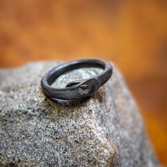 Hand Forged Iron Ring  This ring is made from iron. Forged both round and flat secured together with a iron pin and beautifully textured by the hammer. You will get a custom ring since they are handmade there a not two alike. The natural color of Iron is grey-silver. The iron is darkend the traditional way by burning it in linseed oil. The iron piece will get patina. The natural color shinning through. Some more and some faster, it depends on the wearer.  If Your Size Isn't On The List Don't Hes Forged Ring, Norse Jewelry, Iron Ring, Hand Forged Iron, Custom Ring, Forged Iron, Linseed Oil, Hand Forged, Custom Rings