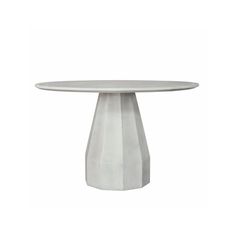 a white table sitting on top of a wooden floor