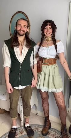 a man and woman dressed up in costumes