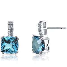 A Swiss affair Inspired by soft, blue skies and charming Swiss blue lakes. These graceful earrings feature cushion cut Peora natural Swiss Blue Topaz gemstones in 14K white gold. Our natural Swiss Blue Topaz gemstones are a unique gift from nature. By cutting them in a way that respects the rough's natural radiance, we ignite their inherent intensity and maximize their brilliance to deliver on our signature Peora standard. Handcrafted in pure 14K white gold goodness, these earrings have been carefully coated in an elegant rhodium finish. Our artisans are expertly trained in this process which fortifies the earring's strength, shine and brilliance. Shopping for birthdays, bridal parties or other occasions? Our concierge stylists are here to help with all of your jewelry questions. Each purc London Blue Topaz Earrings, White Gold Drop Earrings, Jewelry Questions, Blue Topaz Earrings, Sparkle Earrings, Blue Cushions, Topaz Earrings, Swiss Blue Topaz, Silver Shop