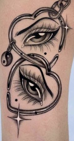 a woman's leg with tattoos on it and an eye in the shape of a heart