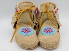 These Native American inspired fringed boot style leather moccasins with beaded rosette are one of our few listings for handmade moccasin that are made to order. We offer different size variations and and this listing is for the color in the picture. The orders for this item are filled on the first come first served basis. It takes us time to hand trace the pattern, hand cut the leather, glue the insoles in and hand stitch the moccasins. We do not use a machine to do any portion of our moccasins Deer Crafts, Running Deer, Native American Moccasins, Handmade Moccasins, Moccasin Pattern, Native Culture, Leather Glue, Beaded Moccasins, Moccasins Style