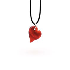 Handcrafted by Dan Neff, these heart pendants are the perfect way to show your love. They are available in amber, green, teal, purple, pink, and red. *Please note that while we do our best to create a cohesive series, not every piece will be identical as it is all handmade and subject to variations. Includes gift box and black satin cord that is adjustable from 14" to 26". Dimensions: 1.5" long x 1" wide Elegant Adjustable Heart Charm Necklace, Heart-shaped Jewelry Gift For Her, Keepsake Double Heart Jewelry With Heart Beads, Elegant Heart-shaped Necklace For Keepsake, Keepsake Heart Pendant Jewelry With Heart Beads, Adjustable Heart-shaped Necklace, Elegant Teardrop Necklace With Heart Charm, Elegant Keepsake Necklaces With Heart Beads, Spiritual Heart Beads Necklaces As Gifts