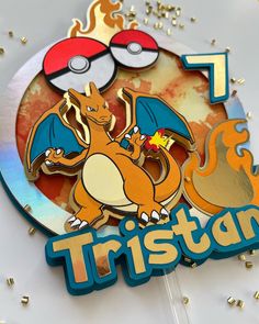 a close up of a pokemon pin with the word tristar in front of it