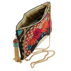 A Must Have this season! This statement bag showcases iconic individuality at its peak. Dress up or down, this bag will be your best friend. Also available inFrida's Flowers Crossbody Phone Bag and Frida's Flowers Crossbody Wallet. DIMENSIONS: 9.5 x 0.5 x 7", Crossbody Chain Strap, Zipper Closure, Fits a Cell Phone Bohemian Embroidered Shoulder Bag For Evening, Bohemian Embroidered Evening Shoulder Bag, Bohemian Summer Evening Clutch, Bohemian Evening Crossbody Shoulder Bag, Beaded Crossbody Clutch, Mary Frances Handbags, Spring Purses, Crossbody Clutch Purse, Artist Bag