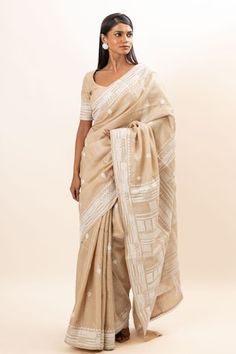 Beige saree with kantha hand embroidery. Paired with a round neck embroidered blouse. - Aza Fashions Chikankari Embroidered Slub Silk Pre-draped Saree For Wedding, Wedding Pre-draped Saree With Chikankari Embroidery In Slub Silk, Wedding Pre-draped Saree In Chikankari Embroidery, Traditional Pre-draped Tussar Silk Saree With Chikankari, Anarkali Style Pre-draped Tussar Silk Saree With Chikankari, Traditional Slub Silk Pre-draped Saree With Chikankari Embroidery, Traditional Cotton Silk Pre-draped Saree With Chikankari Embroidery, Pre-draped Chikankari Saree For Puja, Fitted Pre-draped Saree With Chikankari Embroidery For Puja