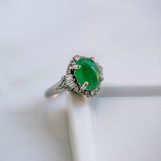 Vintage Mid Century Jade & Diamond Engagement Ring | Amboise Green Cabochon Emerald Ring Fine Jewelry, Elegant Cabochon Emerald Ring, Fine Jewelry Green Cabochon Emerald Ring, Fine Jewelry Green Emerald Cabochon Ring, Elegant Green Cabochon Emerald Ring, Heirloom Green Emerald Oval Cabochon Ring, Heirloom Green Oval Cabochon Emerald Ring, Elegant Emerald Cabochon Ring, Elegant Green Emerald Cabochon Ring