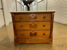 an old wooden dresser in a storage room