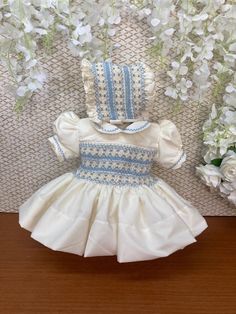 Pre-order handmade smocked romper. Takes from 4-6 weeks to ship. Thank you for your patience.  Thank you for supporting a small business.  Clothing Care Instructions Most items can be washed safely in cold water on delicate cycle and hung to dry. If the item that you are ordering has red or another bright color in it next to a white or other light color fabric please use a Shout color catcher for the first few washes to avoid bleeding. The reds are pre-washed but they are still red and will like Fitted Smocked Dress For Baptism In Summer, Baptism Smocked Dress With Short Sleeves, Fitted Cream Smocked Dress, Baptism Short Sleeve Smocked Dress, Fitted Cream Smocked Dress With Smocked Cuffs, Fitted Dress With Smocked Bodice For Baptism, Summer Baptism Smocked Dress With Smocked Back, Handmade Summer Dress For Baptism, Handmade Summer Baptism Dress