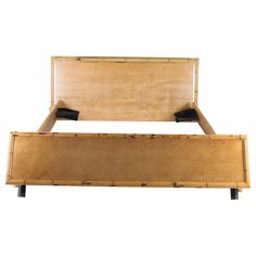 a wooden bed frame with no headboard and foot board