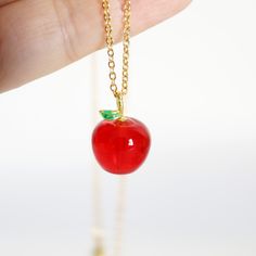 "Beautiful and lovely red apple necklace made of red apple charm with skinny gold plated brass chain. A simple and cute-looking dainty necklace is good for yourself or gift! Your necklace will ship in a gift box. ♥Chain length 15\" - 22\"  ♥Apple Charm 1/2\" x 5/8\"  ♥Resin charm and Gold plated brass chain ♥ Delivery Time Fast shipping within 1 - 3 days  ♥  See more Rudiana Accessories  Rudiana.etsy.com" Cute Red Charm Necklace For Gift, Cute Red Charm Necklaces For Gifts, Princess Behavior, Apple Jewelry, Apple Necklace, Dragon Earrings, Necklace Red, Resin Charms, Pin Jewelry