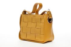 ❤ Product Name: Woven Leather Bag ❤ Color: Mustard ❤ Quality: Top-Quality Italy Accessories  ❤ Outside Material: Mustard Braided Calfskin ❤ Inside Material: Cotton Lining ❤ Bag Dimensions: L 22 x d 10 x h 18 Cm or L 8.6 x D 3.9 x H 7.08 inches ❤ Material: Braided Leather, Woven Leather, Genuine Leather, Inside Cotton Lining Woven Leather Sling Bag - Handmade Crossbody Purse -  Italian leather shoulder bag - Women bag to use every day - Gift for her This bag is made with the Italian craftsmanship and durable quality.  This bag is closed with a zipper and there is only one compartment. The calfskin leather material of this bag makes it worth buying and it has a shoulder strap.  You will have a chic style bag and it has silver color accessories.  It is completely handmade and will be shipped Yellow Square Bag With Detachable Strap, Yellow Square Box Bag With Adjustable Strap, Yellow Square Box Bag For Everyday, Yellow Office Shoulder Bag With Adjustable Strap, Rectangular Bag With Detachable Strap, Rectangular Bag With Detachable Strap For Daily Use, Yellow Box Bag With Adjustable Strap For Everyday, Everyday Rectangular Bag With Detachable Strap, Everyday Rectangular Bag With Detachable Handle