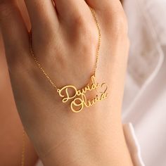 ❤️Perfect Gift for loved ones. ❤️DOUBLE NAME NECKLACE WITH HEART ❤️Your purchase will arrive in a gift box ❤️ All our jewelry is handmade with Love and Care in our workshop  DETAILS Material: High-Quality Solid 925 Sterling Silver  Finish: Silver Plated, Rose Plated, Gold Plated   PROCESSING & SHIPPING All items purchased will be shipped within 2-7 business days. You can upgrade your shipping to Express during check out if you want it faster 🚀Standard Shipping Time for the US: 2- 7 business days worldwide 🚀Express Shipping Time: 1-5 business days worldwide  ASSURANCE ✧ Nickel Free ✧ Tarnish Resistant ✧ High-Quality Materials ATTENTION PLEASE This necklace will be custom made especially for you by hand in our studio with love and care. We can't accept returns or exchanges on customised pi Customized Name Necklace For Anniversary Gift, Names Necklace For Anniversary Gift On Valentine's Day, Names Necklace For Anniversary, Valentine's Day Gift, Personalized Name Necklaces For Anniversary On Valentine's Day, Personalized Name Necklaces For Valentine's Day Anniversary, Customized Necklace For Anniversary, Valentine's Day Name Necklaces, Customized Necklace For Father's Day Anniversary Gift, Valentine's Day Gift Name Necklace With Letter Pendant