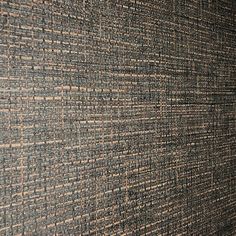 the wall is made up of many different colors and patterns, including brown and blue