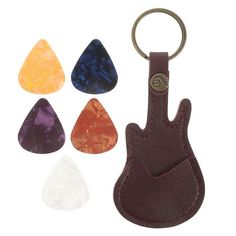 a leather keychain with five different colored stones in it and a metal hook